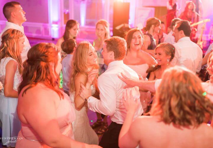 Bride and groom dancing at Wiley Entertainment hosted wedding reception