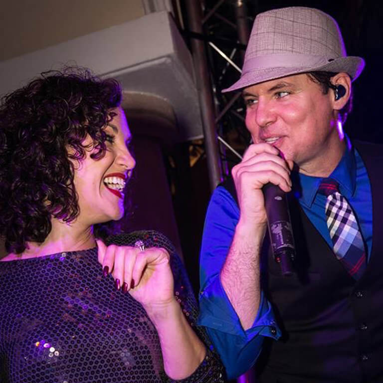 Lyli and Clint of Wiley Entertainment performing for corporate event